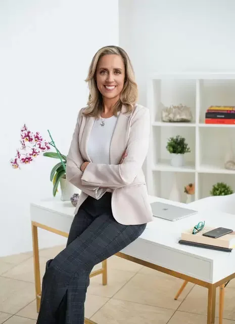 Laura Burkey in a bright studio, ready for conversation
